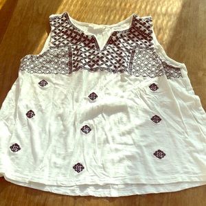 White tank with blue pattern on front